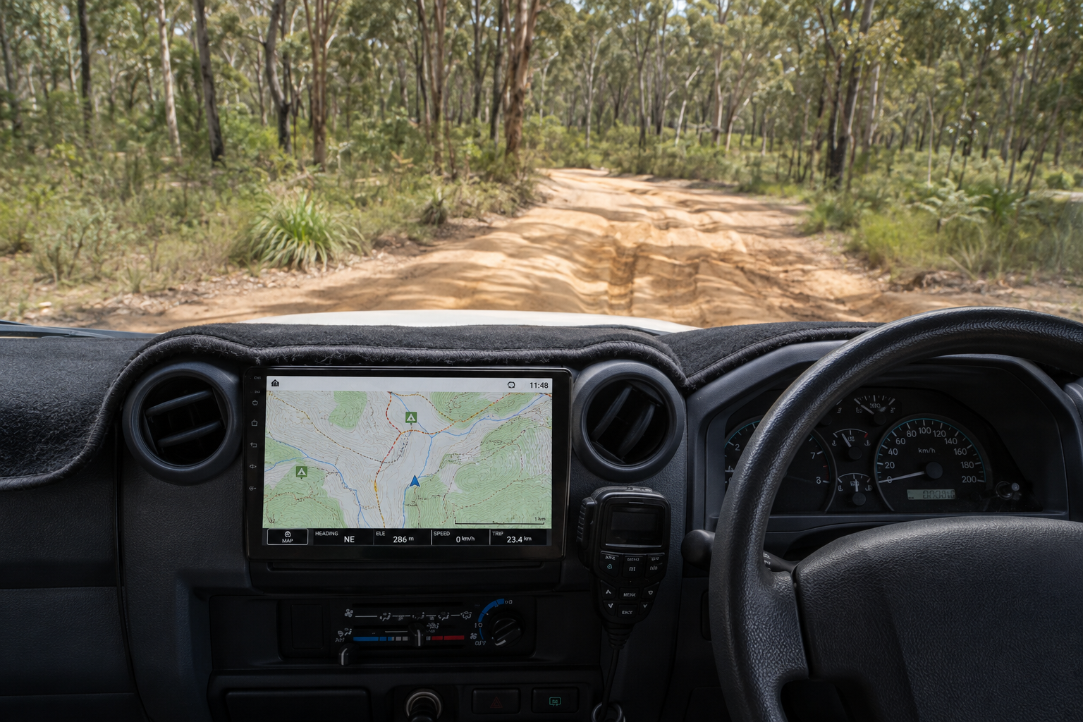 Detailed off-road navigation map inside a 4x4 overlooking a bush track
