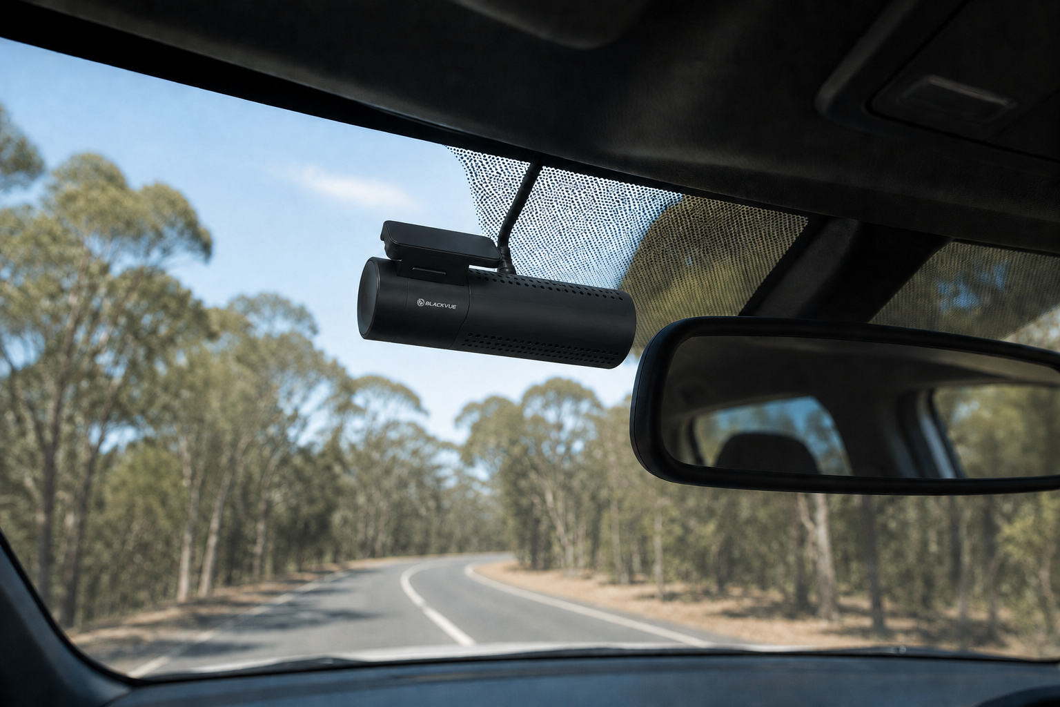 BlackVue dash camera mounted beside the rear-view mirror with concealed cabling