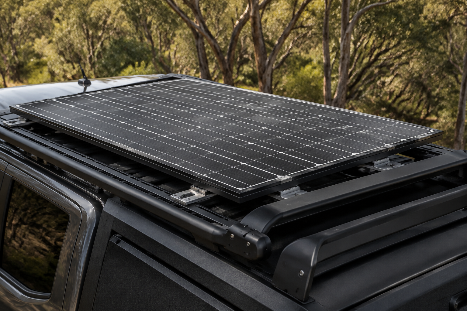Solar panel mounted on a touring vehicle roof rack