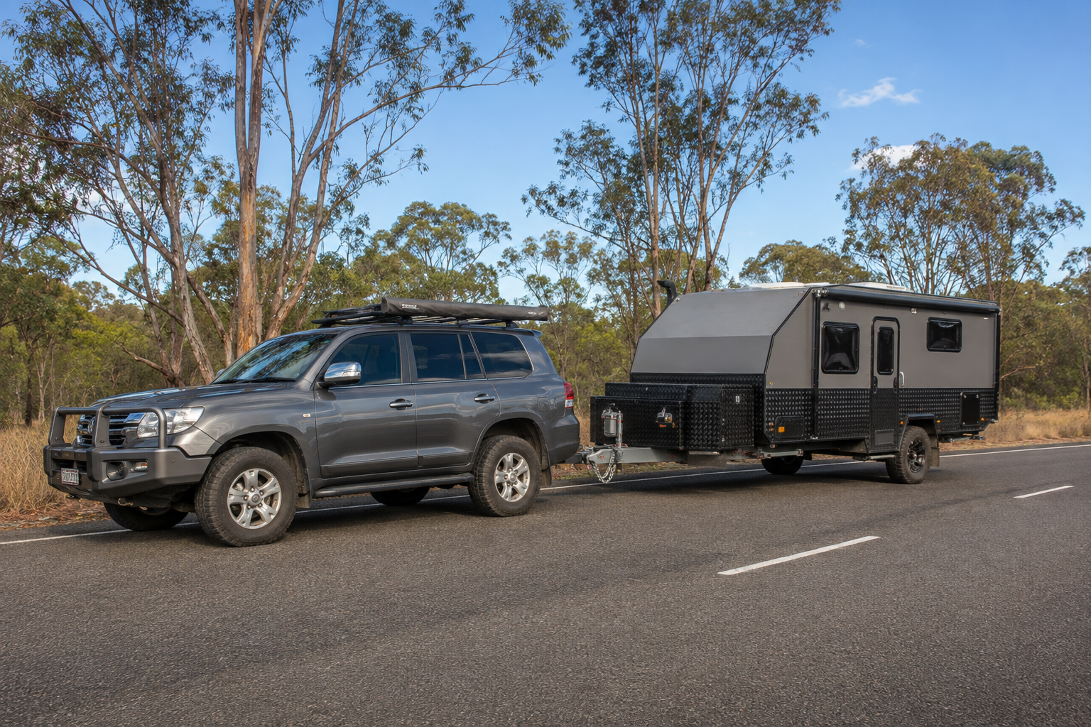 4x4 connected to a touring caravan on a rural road